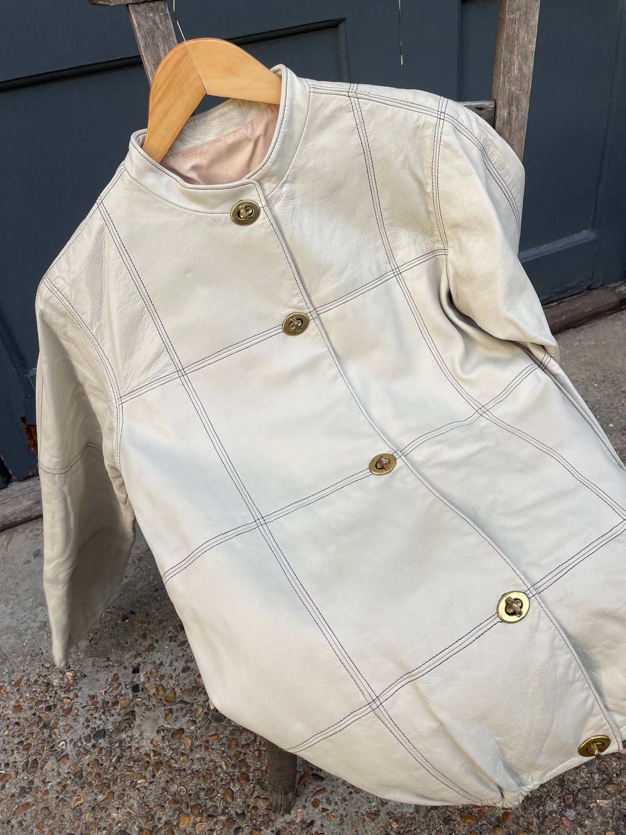 Vintage ecru leather jacket with Postman’s lock closure