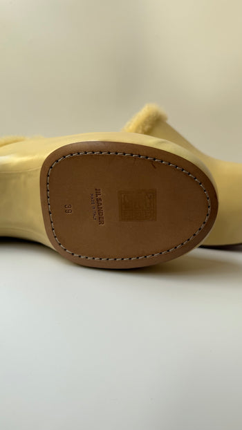 Jil Sander ‘Indulgence’ fur lined clogs in butter yellow 39