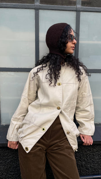 Vintage ecru leather jacket with Postman’s lock closure