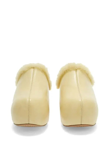 Jil Sander ‘Indulgence’ fur lined clogs in butter yellow 39
