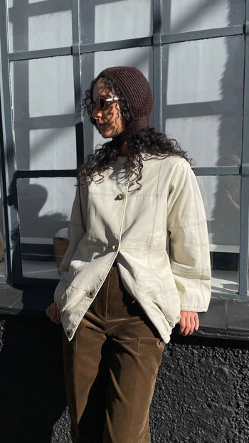 Vintage ecru leather jacket with Postman’s lock closure