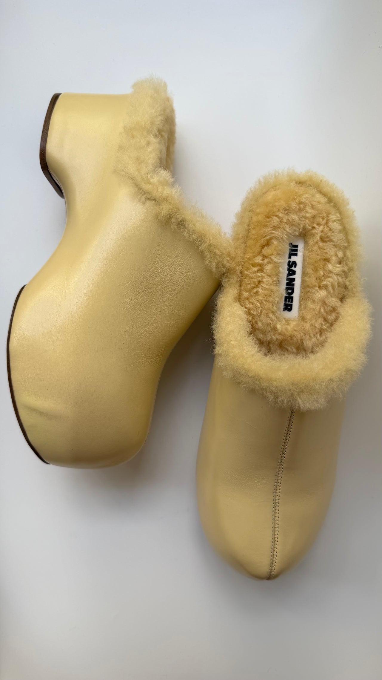 Jil Sander ‘Indulgence’ fur lined clogs in butter yellow 39