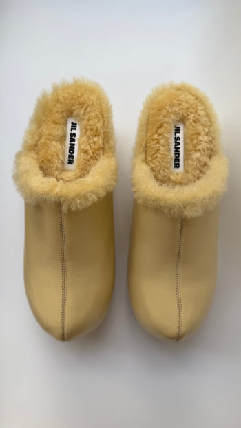 Jil Sander ‘Indulgence’ fur lined clogs in butter yellow 39